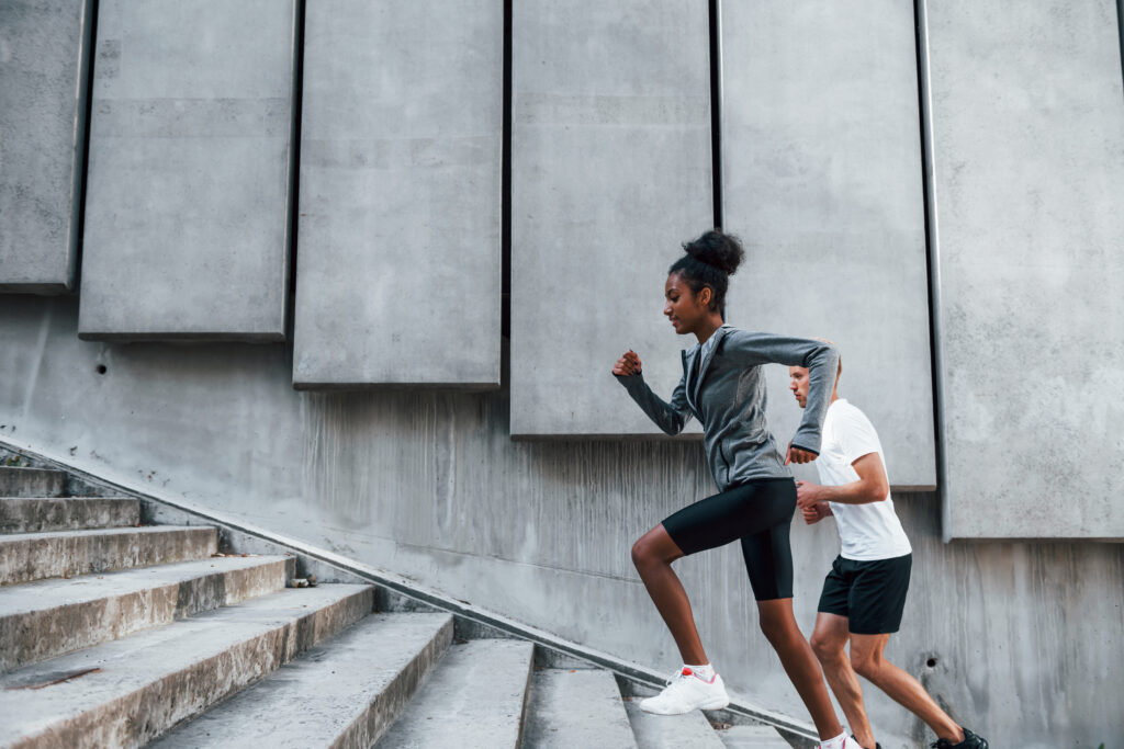 Couple running up stairs