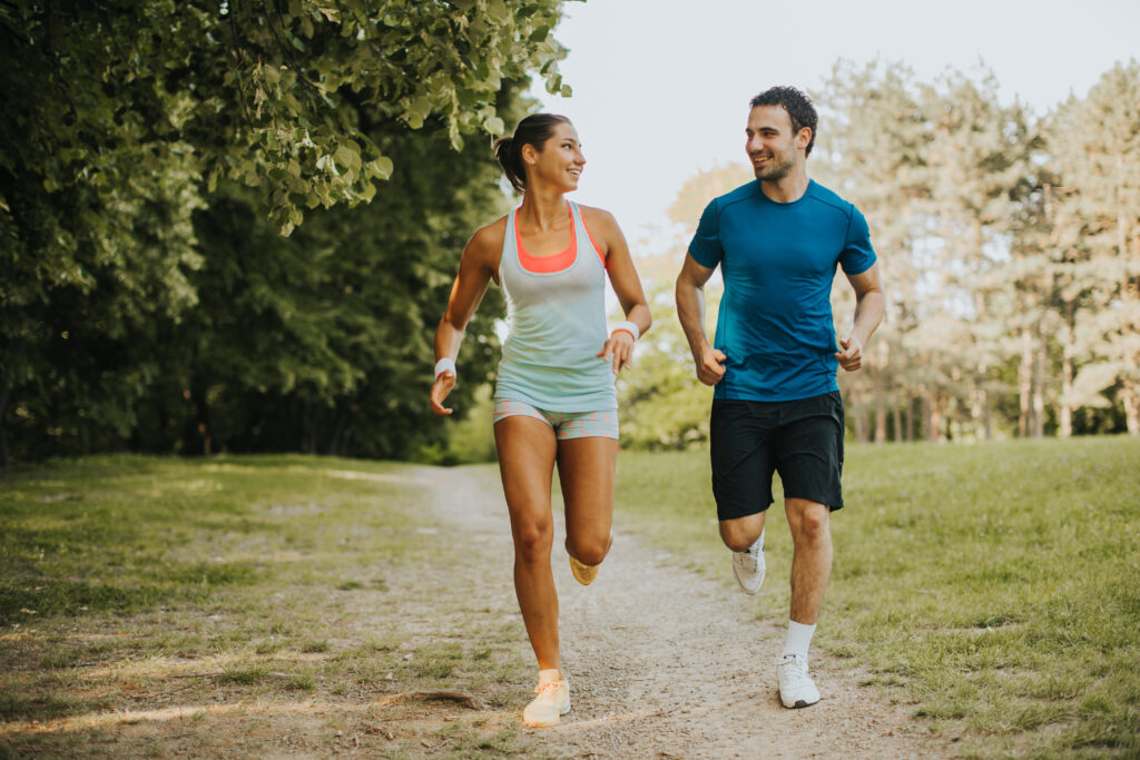 Young couple running in the park